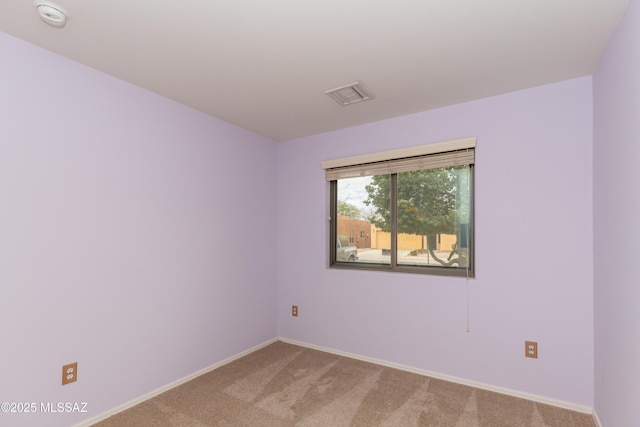 6591 S Avenida Santa Carolina, Tucson, AZ 85756 - unfurnished room featuring light carpet, baseboards, and a smoke detector