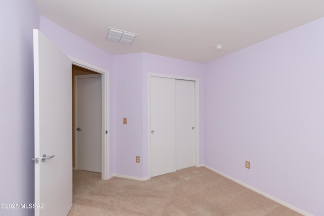 6591 S Avenida Santa Carolina, Tucson, AZ 85756 - unfurnished bedroom with light carpet, a closet, and baseboards