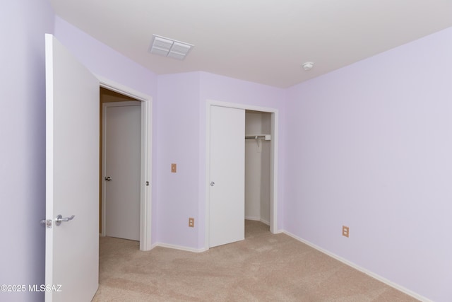 6591 S Avenida Santa Carolina, Tucson, AZ 85756 - unfurnished bedroom featuring light colored carpet, a closet, and baseboards