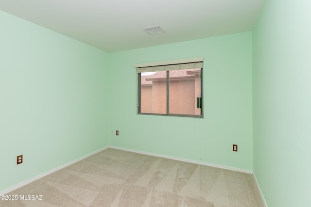 6591 S Avenida Santa Carolina, Tucson, AZ 85756 - spare room featuring light carpet and baseboards