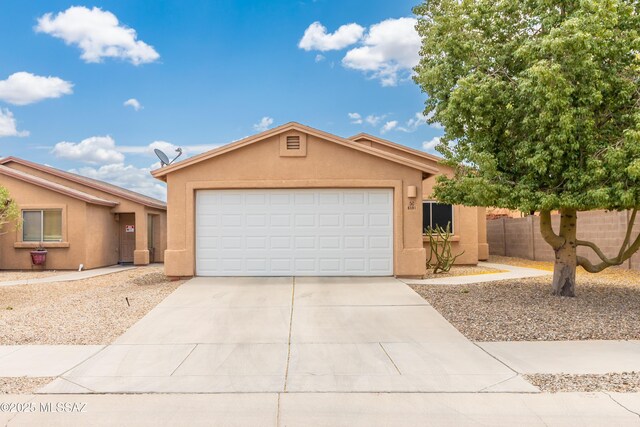 6591 S Avenida Santa Carolina, Tucson, AZ 85756 - single story home featuring stucco siding, fence, concrete driveway, and a garage