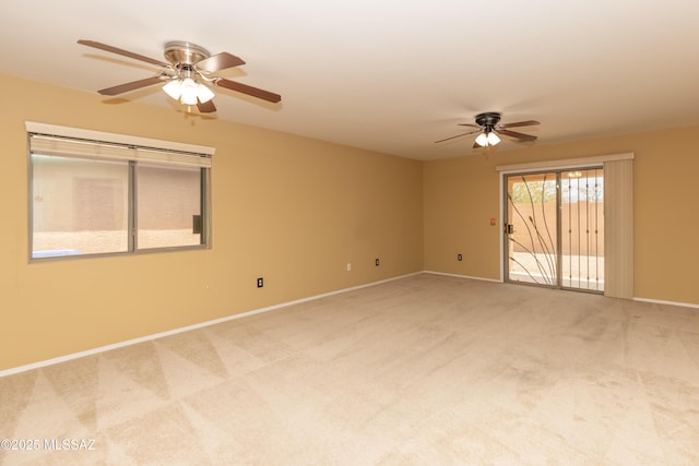 6591 S Avenida Santa Carolina, Tucson, AZ 85756 - spare room with a ceiling fan, light colored carpet, and baseboards