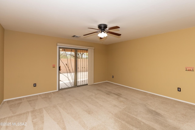 6591 S Avenida Santa Carolina, Tucson, AZ 85756 - empty room with a ceiling fan, light carpet, and baseboards