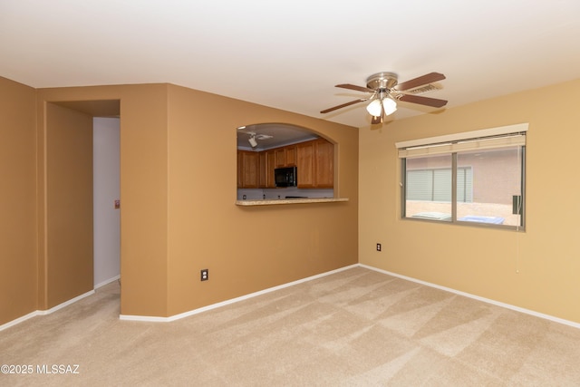 6591 S Avenida Santa Carolina, Tucson, AZ 85756 - unfurnished room with light colored carpet, a ceiling fan, and baseboards