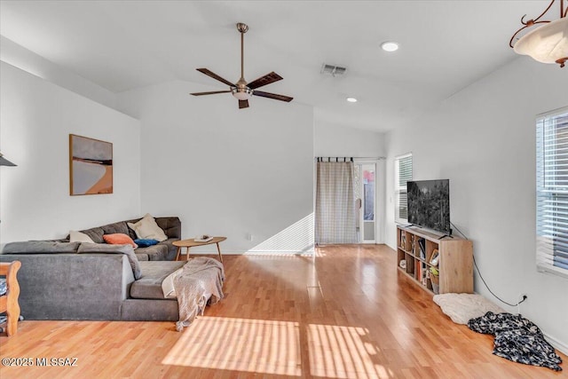 7497 W Mission View Pl, Tucson, AZ 85743 - living room featuring lofted ceiling, plenty of natural light, a ceiling fan, wood finished floors, and recessed lighting