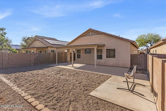 7497 W Mission View Pl, Tucson, AZ 85743 - rear view of property with a patio, stucco siding, a fenced backyard, and a tile roof