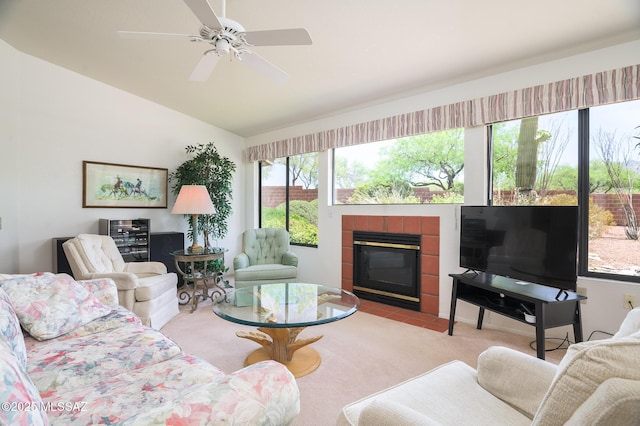 14670 N Wonderview Dr, Oro Valley, AZ 85755 - living area featuring a tiled fireplace, vaulted ceiling, and a ceiling fan