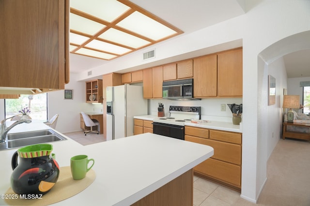 14670 N Wonderview Dr, Oro Valley, AZ 85755 - kitchen with white appliances, arched walkways, a sink, light countertops, and a peninsula