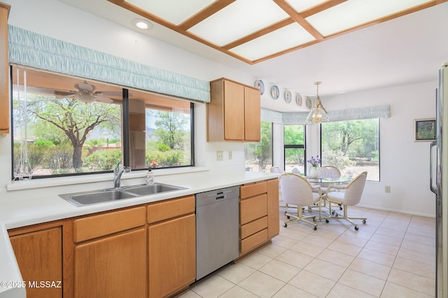14670 N Wonderview Dr, Oro Valley, AZ 85755 - kitchen featuring stainless steel dishwasher, a sink, light countertops, and healthy amount of natural light