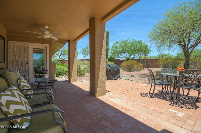 14670 N Wonderview Dr, Oro Valley, AZ 85755 - fenced backyard with ceiling fan, a patio, area for grilling, and outdoor dining area