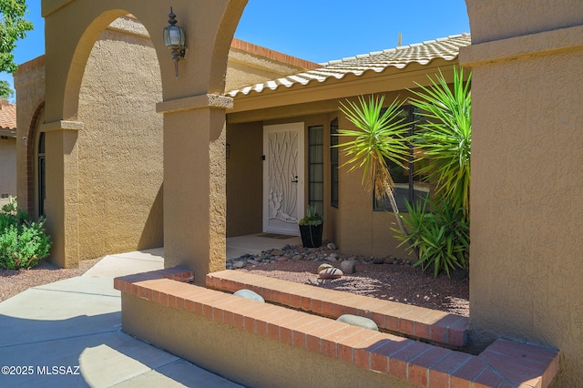14670 N Wonderview Dr, Oro Valley, AZ 85755 - doorway to property with stucco siding and a tiled roof