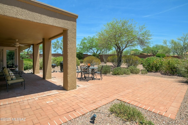 14670 N Wonderview Dr, Oro Valley, AZ 85755 - fenced backyard with ceiling fan, a patio area, and outdoor dining area