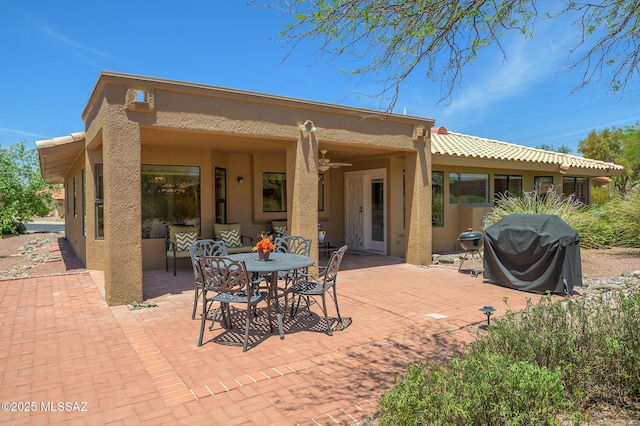 14670 N Wonderview Dr, Oro Valley, AZ 85755 - view of patio / terrace with grilling area, outdoor dining space, and a ceiling fan
