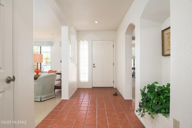 14670 N Wonderview Dr, Oro Valley, AZ 85755 - entryway featuring arched walkways, tile patterned floors, and baseboards