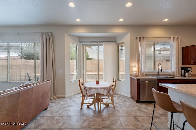 dining area with recessed lighting and baseboards