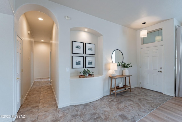 entryway with arched walkways