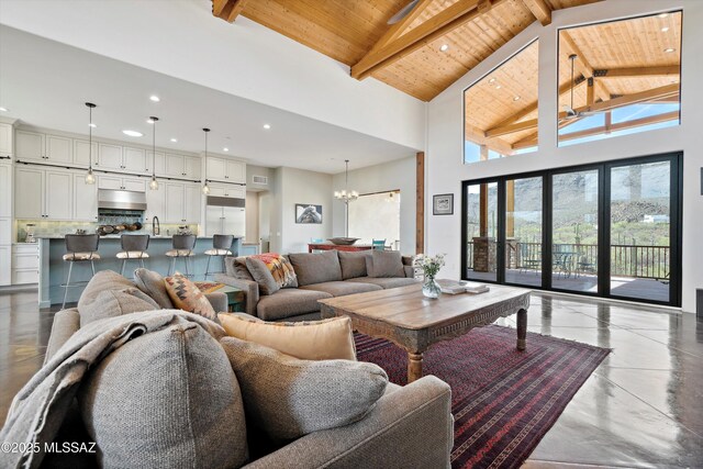 6695 W Banded Gecko Way, Tucson, AZ 85745 - living room featuring wood ceiling, beam ceiling, a chandelier, recessed lighting, and high vaulted ceiling