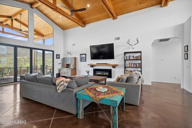 6695 W Banded Gecko Way, Tucson, AZ 85745 - living area featuring ceiling fan, wooden ceiling, arched walkways, high vaulted ceiling, and concrete floors