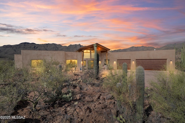 6695 W Banded Gecko Way, Tucson, AZ 85745 - southwest-style home with a mountain view, stucco siding, driveway, and a garage