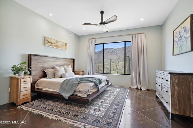 6695 W Banded Gecko Way, Tucson, AZ 85745 - bedroom with recessed lighting, finished concrete flooring, a ceiling fan, and a mountain view