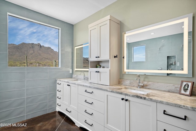 6695 W Banded Gecko Way, Tucson, AZ 85745 - bathroom featuring tiled shower, a mountain view, and double vanity