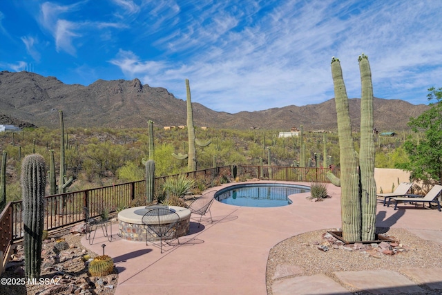 6695 W Banded Gecko Way, Tucson, AZ 85745 - view of swimming pool featuring a mountain view, a patio area, and fence
