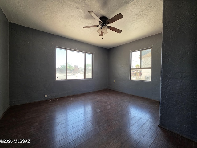 3638 S Bronson Ave, Tucson, AZ 85713 - empty room featuring a textured wall, hardwood / wood-style flooring, ceiling fan, and a textured ceiling