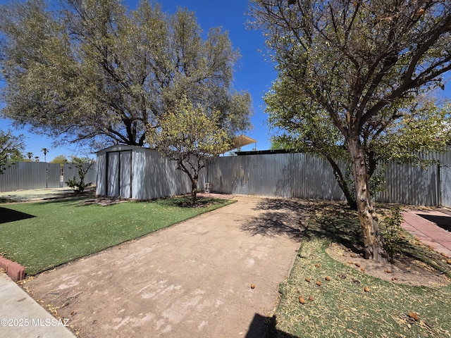 3638 S Bronson Ave, Tucson, AZ 85713 - view of yard with a storage unit, an outbuilding, and a patio