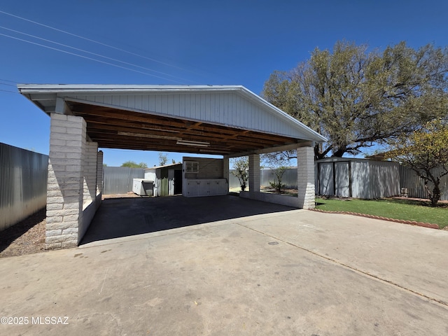 3638 S Bronson Ave, Tucson, AZ 85713 - view of vehicle parking with a storage shed and driveway