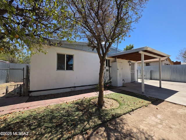 3638 S Bronson Ave, Tucson, AZ 85713 - rear view of house featuring a patio, fence, and stucco siding