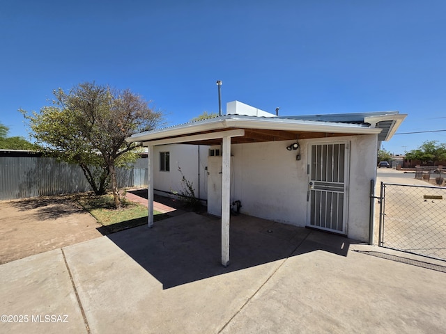 3638 S Bronson Ave, Tucson, AZ 85713 - back of house featuring a patio, stucco siding, and fence