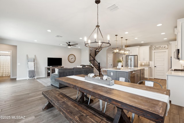 11479 N Desert Calico Loop, Tucson, AZ 85742 - dining space featuring a chandelier, light wood-style flooring, recessed lighting, baseboards, and ceiling fan
