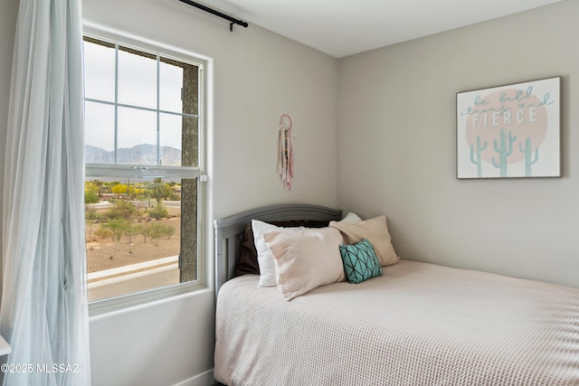 11479 N Desert Calico Loop, Tucson, AZ 85742 - bedroom featuring multiple windows and a mountain view