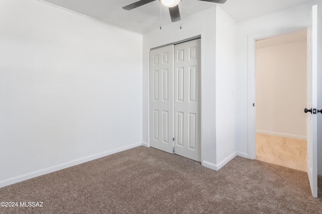 4029 E Fort Lowell Rd, Tucson, AZ 85712 - unfurnished bedroom featuring carpet flooring, a closet, ceiling fan, and baseboards