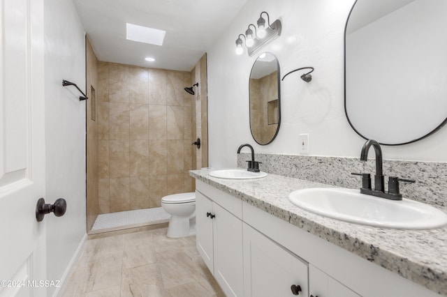 4029 E Fort Lowell Rd, Tucson, AZ 85712 - full bathroom featuring toilet, tiled shower, and double vanity