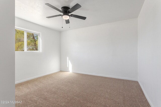 4029 E Fort Lowell Rd, Tucson, AZ 85712 - unfurnished room with carpet, baseboards, and a ceiling fan