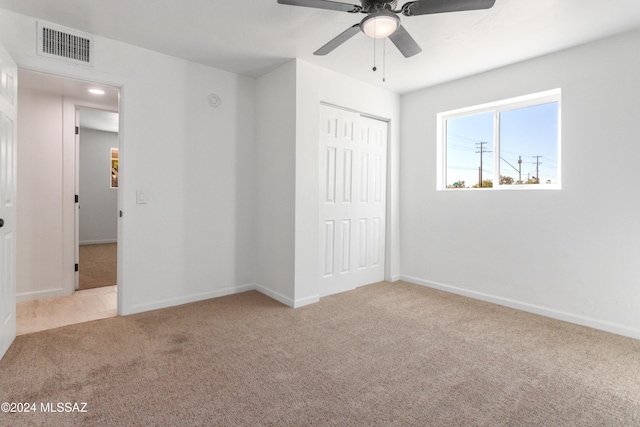 4029 E Fort Lowell Rd, Tucson, AZ 85712 - unfurnished bedroom with carpet, a closet, baseboards, and ceiling fan