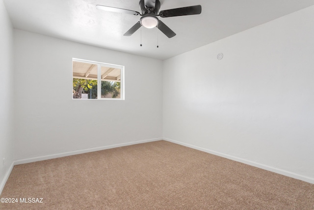 4029 E Fort Lowell Rd, Tucson, AZ 85712 - carpeted spare room featuring baseboards and a ceiling fan