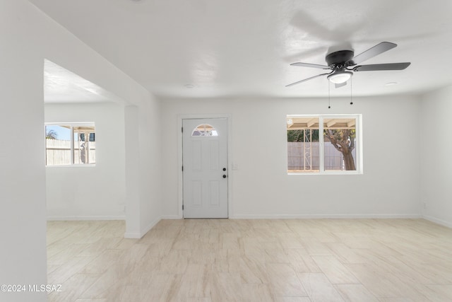 4029 E Fort Lowell Rd, Tucson, AZ 85712 - foyer entrance with ceiling fan and baseboards