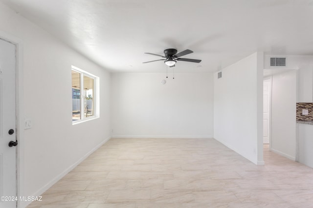 4029 E Fort Lowell Rd, Tucson, AZ 85712 - unfurnished room with ceiling fan and baseboards