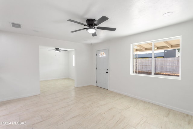 4029 E Fort Lowell Rd, Tucson, AZ 85712 - spare room featuring a ceiling fan and baseboards