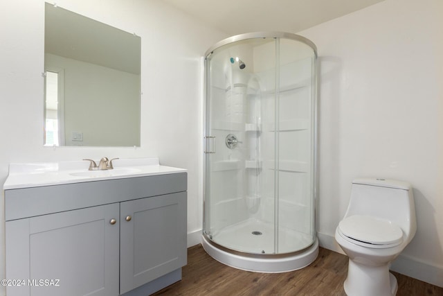 4367 N Radin Ave, Tucson, AZ 85705 - full bathroom featuring vanity, toilet, a shower stall, and wood finished floors
