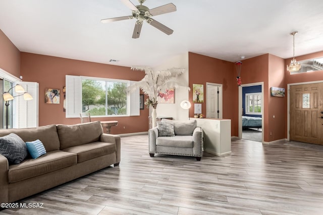 1497 W Carmel Pointe Dr, Oro Valley, AZ 85737 - living area featuring ceiling fan, light wood finished floors, baseboards, and a chandelier
