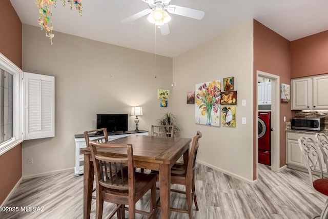 1497 W Carmel Pointe Dr, Oro Valley, AZ 85737 - dining space with light wood finished floors, ceiling fan, washer / clothes dryer, and baseboards