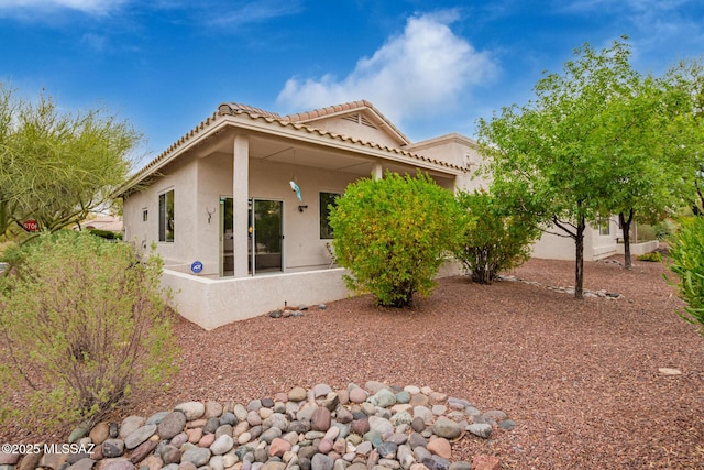 1497 W Carmel Pointe Dr, Oro Valley, AZ 85737 - view of property exterior featuring stucco siding and a tiled roof