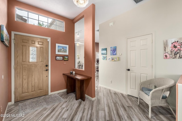 1497 W Carmel Pointe Dr, Oro Valley, AZ 85737 - entrance foyer featuring a towering ceiling, wood finished floors, baseboards, and a ceiling fan