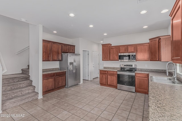10560 E Forest Falls Ct, Tucson, AZ 85747 - kitchen featuring appliances with stainless steel finishes, a sink, recessed lighting, light countertops, and light tile patterned flooring