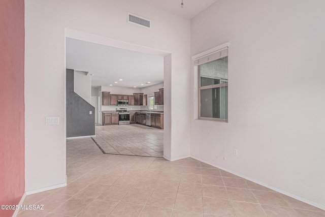 10560 E Forest Falls Ct, Tucson, AZ 85747 - spare room with light tile patterned floors, baseboards, and recessed lighting