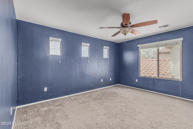 10560 E Forest Falls Ct, Tucson, AZ 85747 - spare room with ceiling fan, carpet, and baseboards