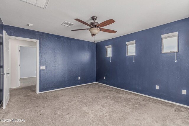 10560 E Forest Falls Ct, Tucson, AZ 85747 - unfurnished room featuring carpet flooring, ceiling fan, baseboards, and a smoke detector
